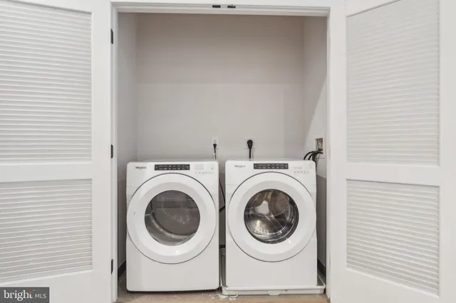 a view of a chairs and table in the balcony