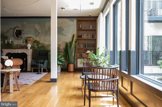 a building outdoor space with patio furniture and potted plants