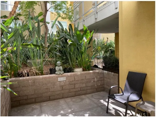 a view of backyard with outdoor seating