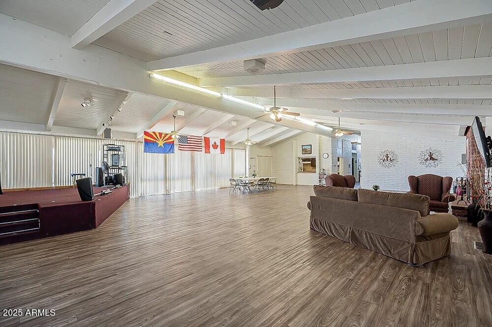 10220 East Apache Trail, Unit 28 Apache Junction, AZ 85120 - Photo 17 of 18 a living room with furniture and a wooden floor