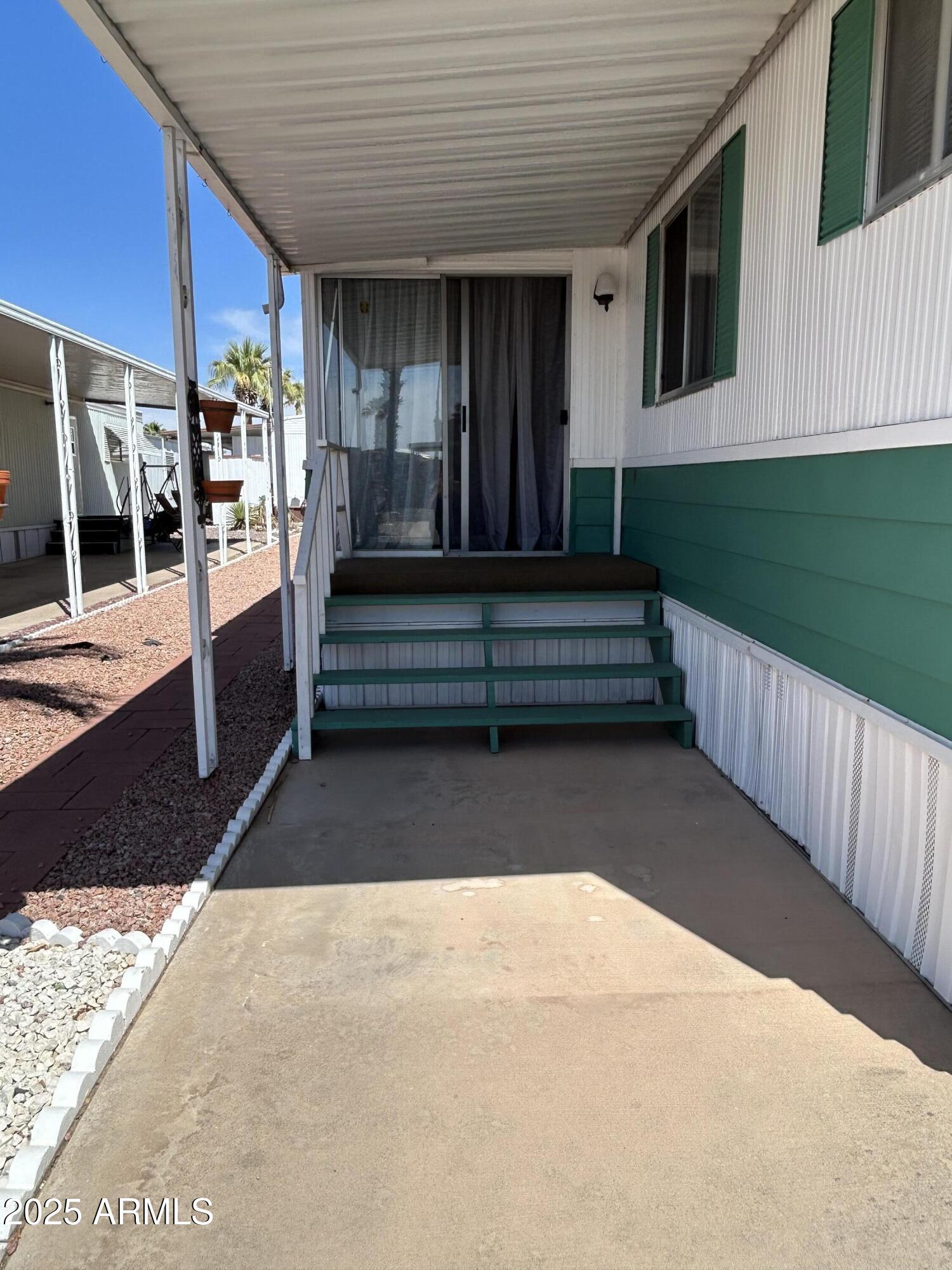10220 East Apache Trail, Unit 28 Apache Junction, AZ 85120 - Photo 2 of 18 a view of backyard with outdoor seating