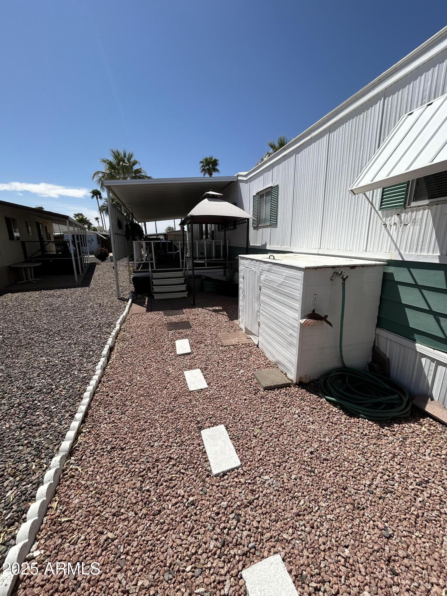 10220 East Apache Trail, Unit 28 Apache Junction, AZ 85120 - Photo 3 of 18 a kitchen with a sink and cabinets