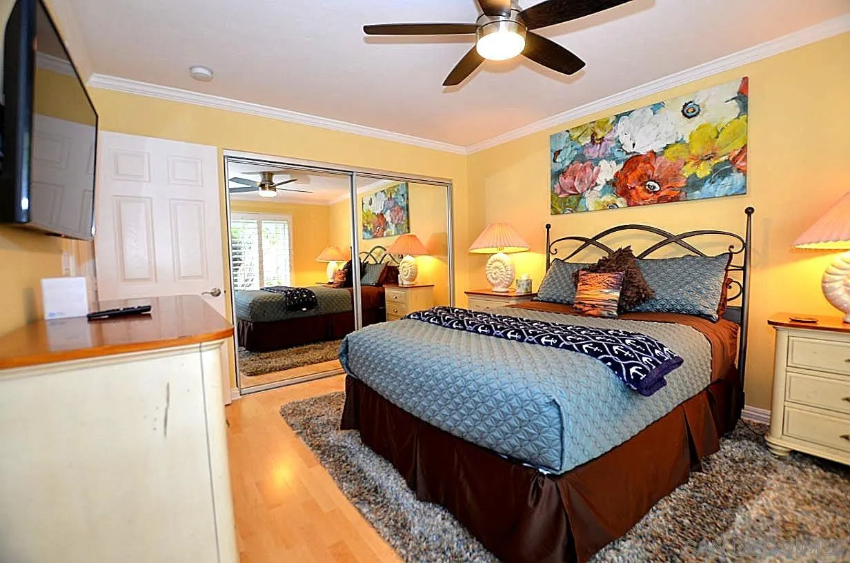 95 Port Of Spain Road Coronado, CA 92118 - Photo 12 of 40 a bed room with a bed window and flat screen tv