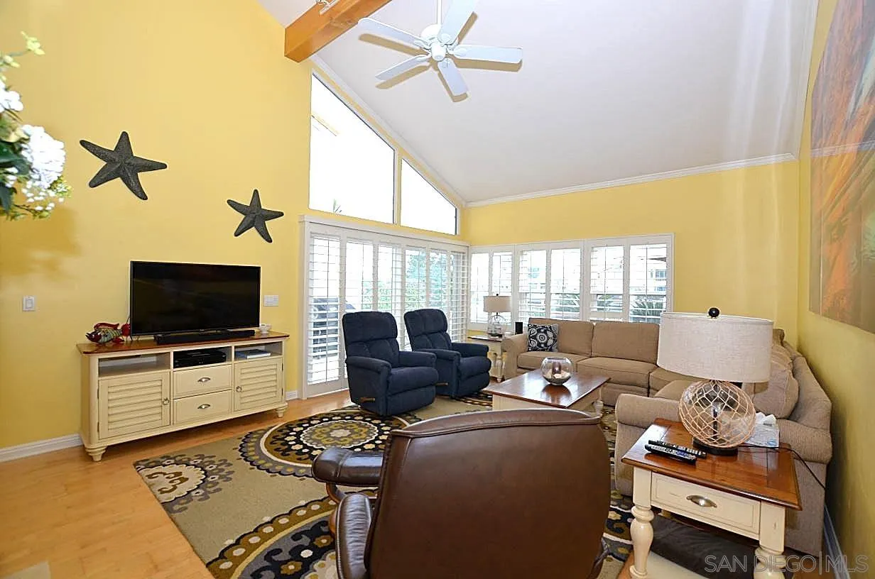 95 Port Of Spain Road Coronado, CA 92118 - Photo 2 of 40 a living room with furniture and a flat screen tv
