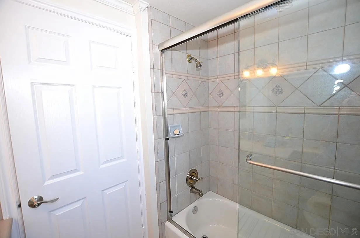 95 Port Of Spain Road Coronado, CA 92118 - Photo 28 of 40 a bathroom with a bathtub and shower