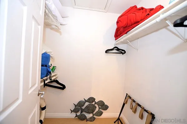 a view of gym equipment with wooden floor