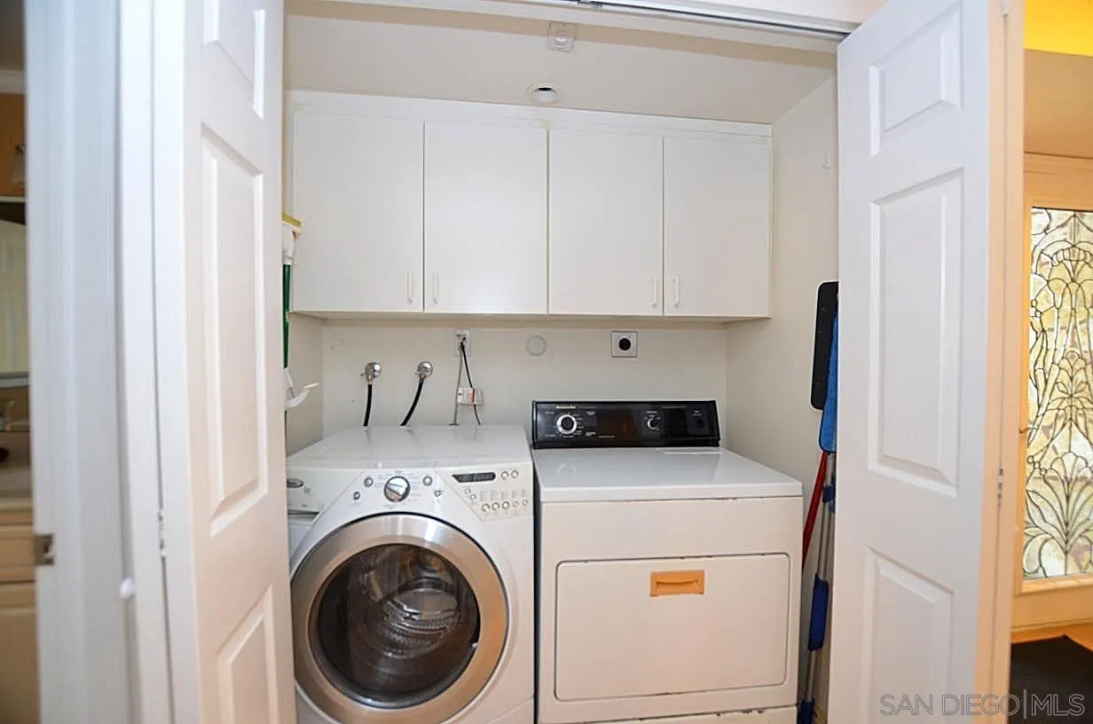 95 Port Of Spain Road Coronado, CA 92118 - Photo 30 of 40 a utility room with dryer and washer
