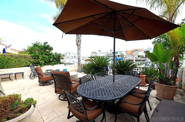 a view of a chairs and table in the patio