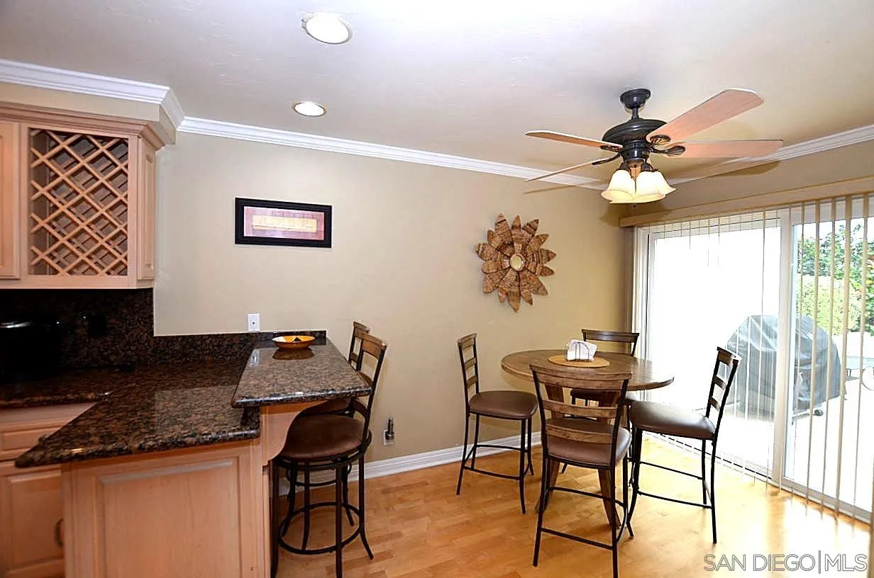 95 Port Of Spain Road Coronado, CA 92118 - Photo 10 of 40 a view of a workspace with furniture and a chandelier