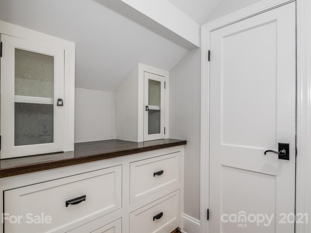 1408 Lilac Road Charlotte, NC 28209 - Photo 14 of 23 a bathroom with a sink and mirror