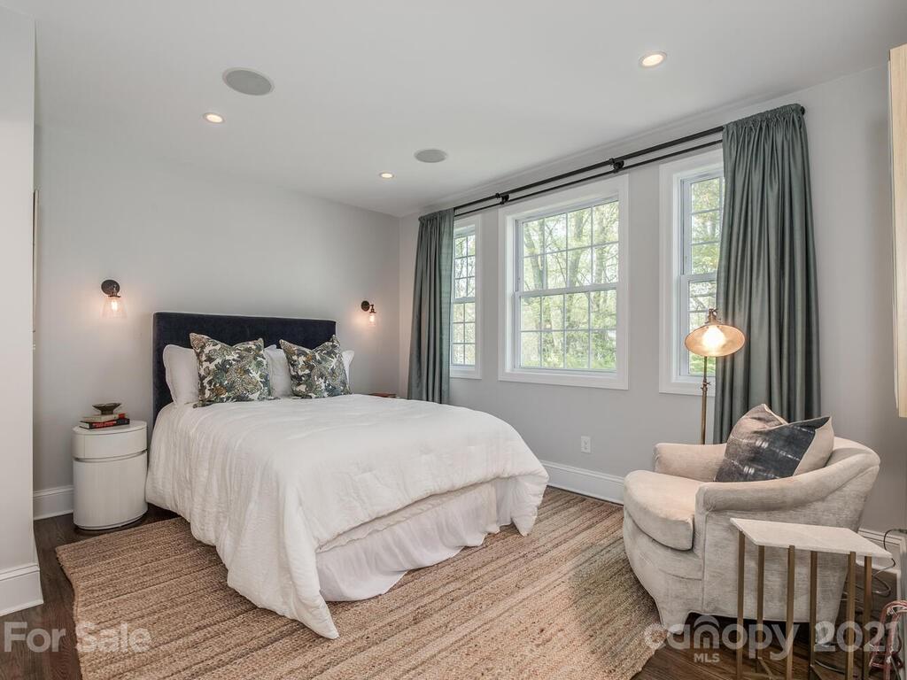 1408 Lilac Road Charlotte, NC 28209 - Photo 15 of 23 a bedroom with a bed and a large window