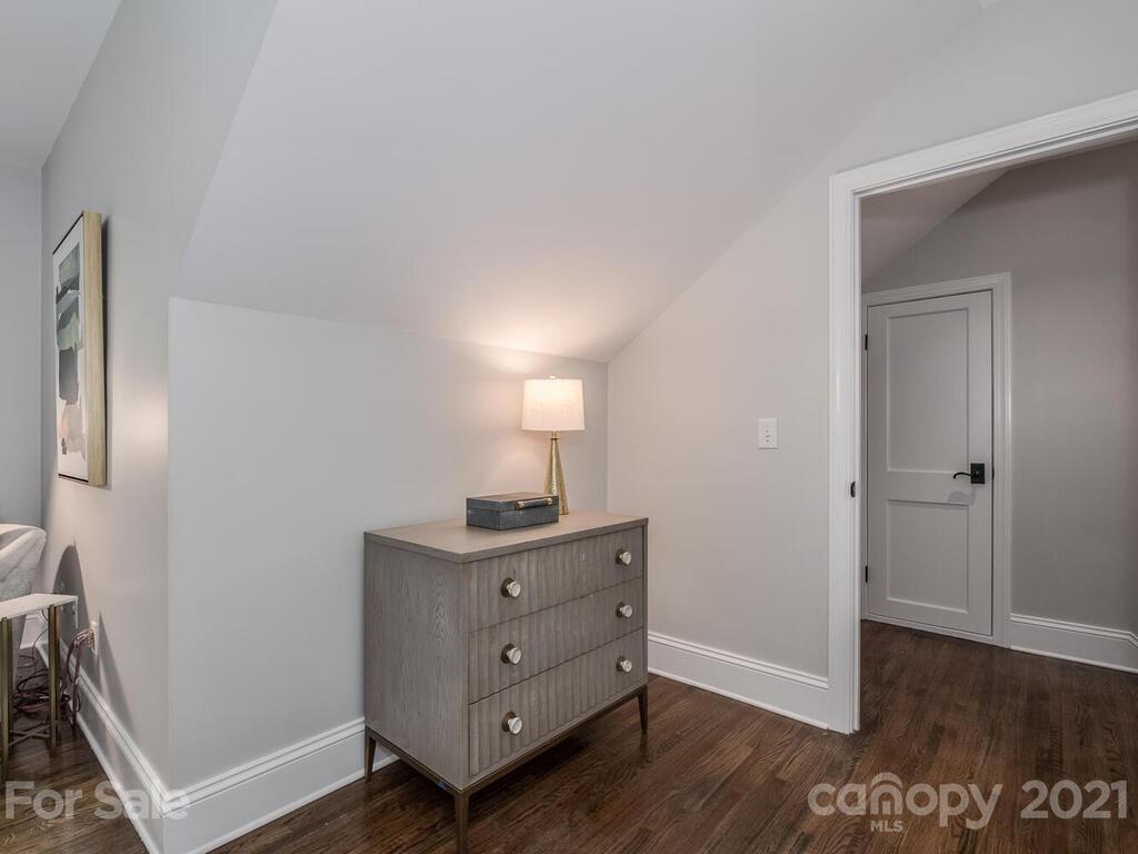 1408 Lilac Road Charlotte, NC 28209 - Photo 19 of 23 a view of a room with wooden floor cabinet and mirror