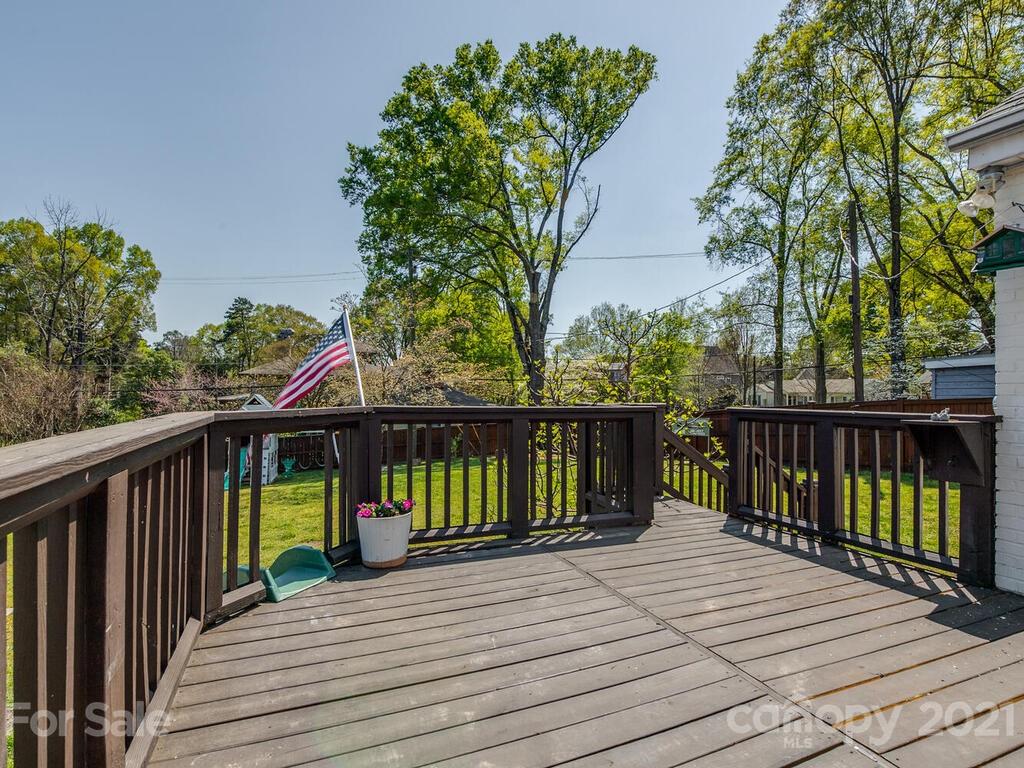 1408 Lilac Road Charlotte, NC 28209 - Photo 20 of 23 a view of a wooden deck