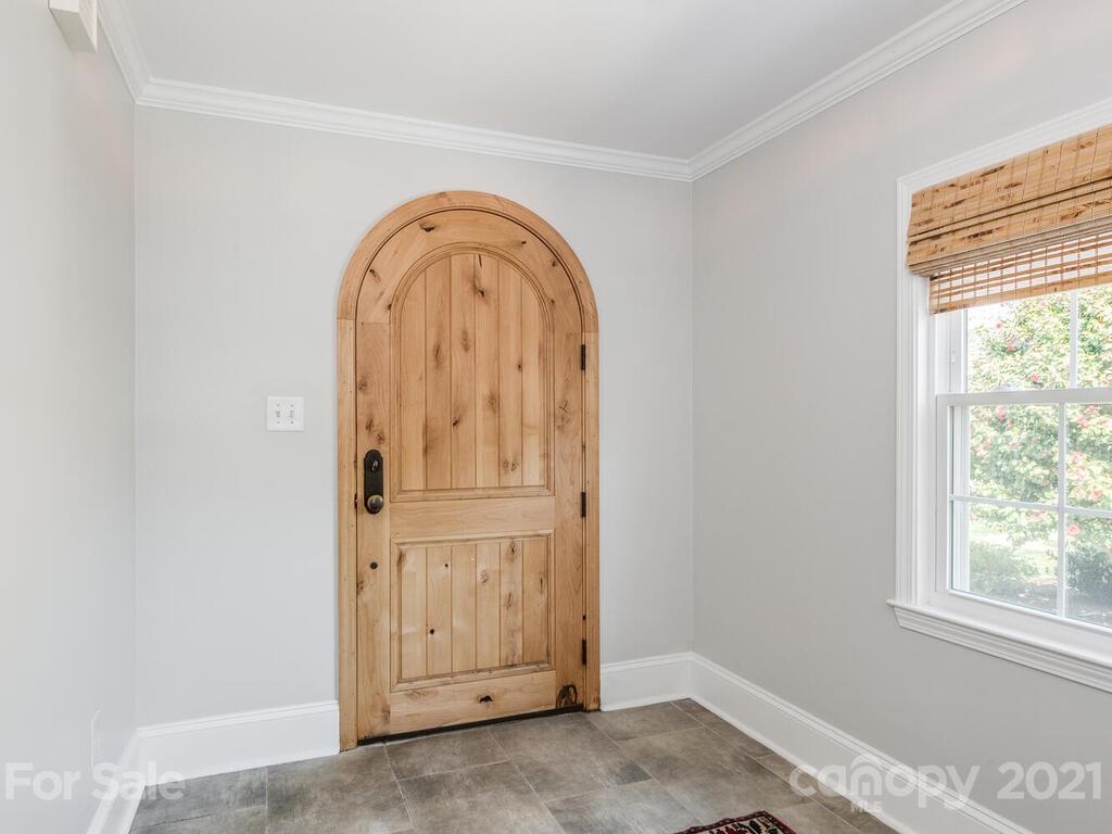 1408 Lilac Road Charlotte, NC 28209 - Photo 3 of 23 an empty room with windows