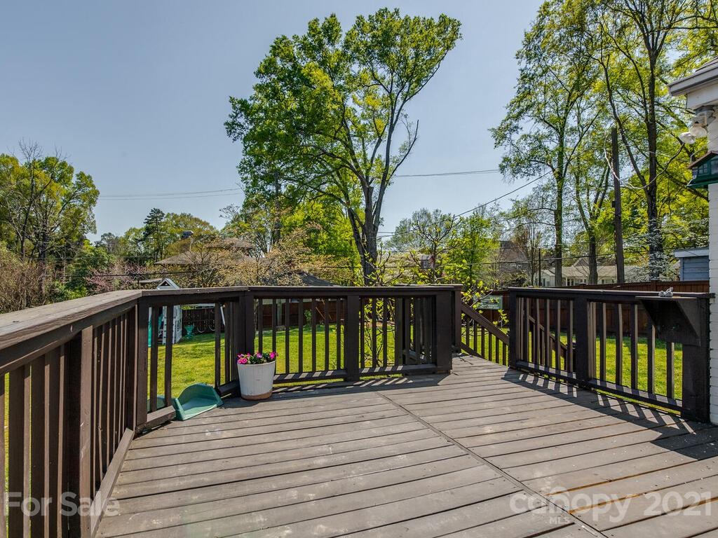 1408 Lilac Road Charlotte, NC 28209 - Photo 21 of 23 a view of a balcony with wooden floor and fence