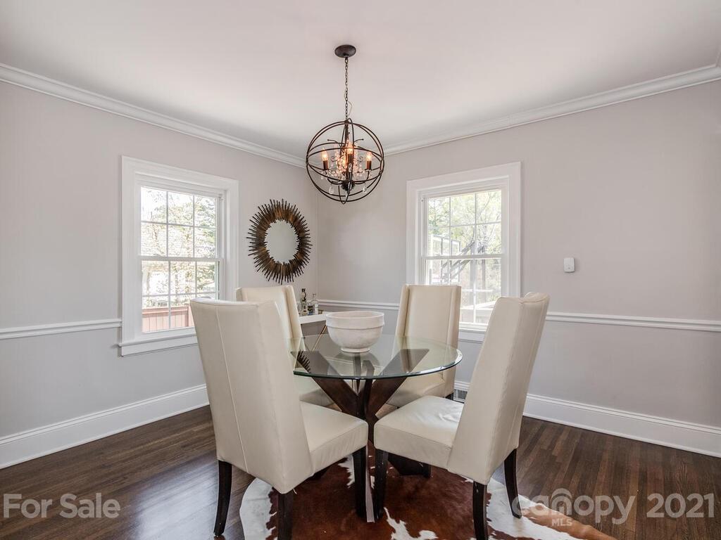 1408 Lilac Road Charlotte, NC 28209 - Photo 7 of 23 a view of a dining room with furniture window and wooden floor