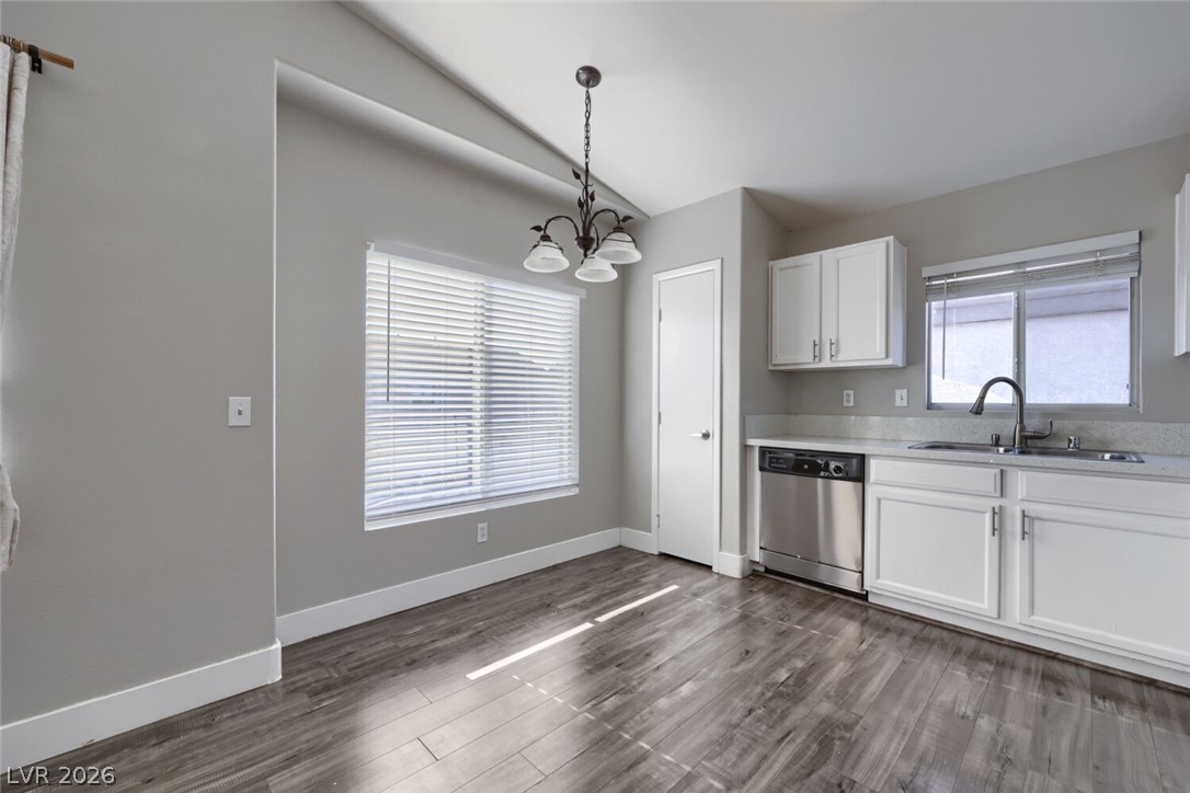 5985 High Steed Street, Unit 101 Henderson, NV 89011 - Photo 16 of 38 A well-lit kitchen area with stainless steel appliances and durable flooring.
