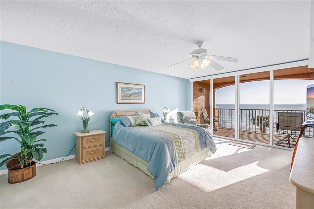 16326 Gulf Boulevard, Unit 308 Redington Beach, FL 33708 - Photo 16 of 44 a bedroom with bed and a large window