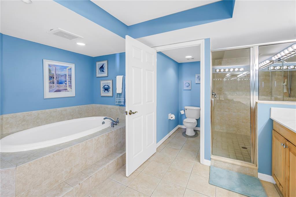 16326 Gulf Boulevard, Unit 308 Redington Beach, FL 33708 - Photo 20 of 44 a bathroom with a tub a shower and a sink