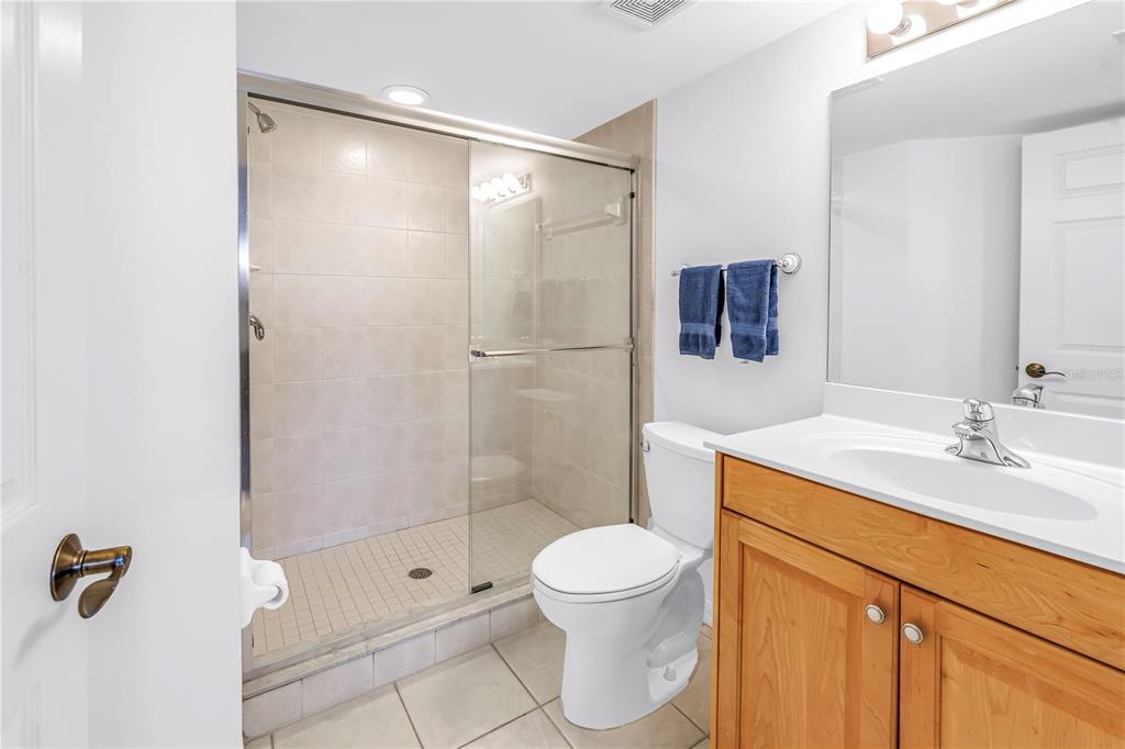16326 Gulf Boulevard, Unit 308 Redington Beach, FL 33708 - Photo 25 of 44 a bathroom with a sink a toilet and shower