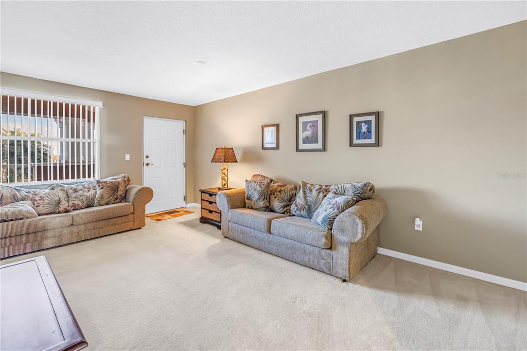 16326 Gulf Boulevard, Unit 308 Redington Beach, FL 33708 - Photo 26 of 44 a living room with furniture and a couch