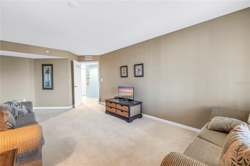 16326 Gulf Boulevard, Unit 308 Redington Beach, FL 33708 - Photo 27 of 44 a bedroom with a bed and window