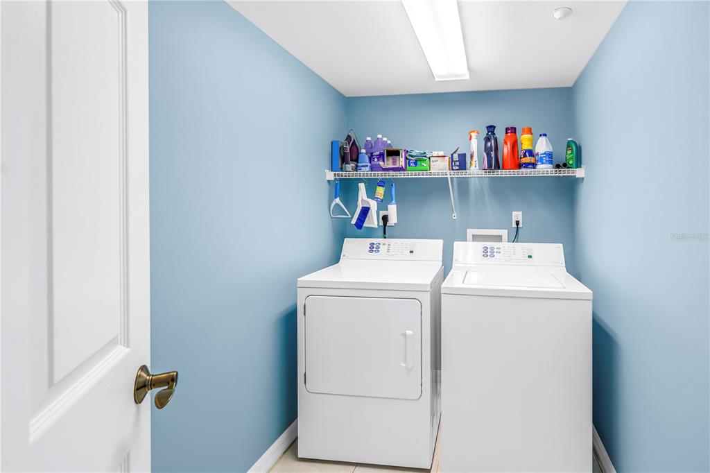 16326 Gulf Boulevard, Unit 308 Redington Beach, FL 33708 - Photo 29 of 44 a utility room with dryer and washer