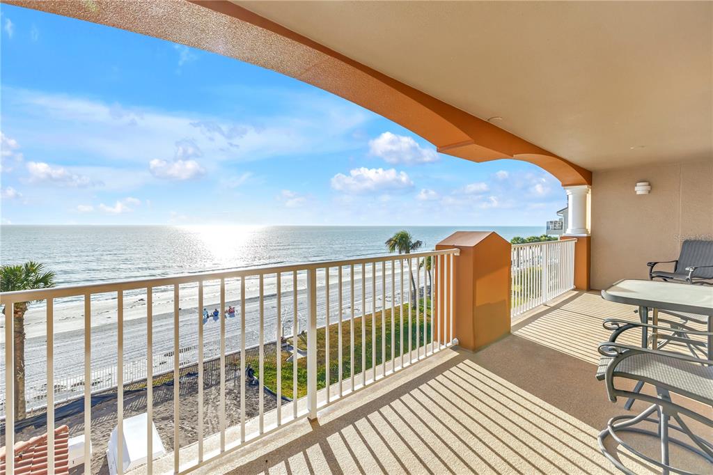 16326 Gulf Boulevard, Unit 308 Redington Beach, FL 33708 - Photo 30 of 44 a view of a balcony with wooden floor and furniture