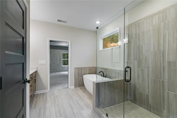 a bathroom with a sink and shower