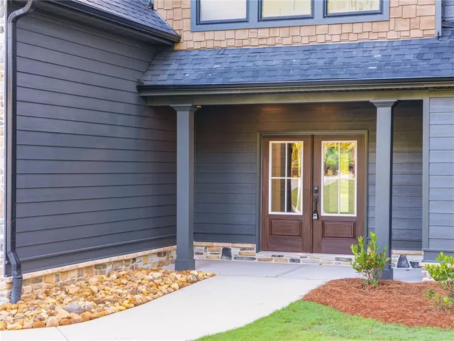 a front view of a house having yard