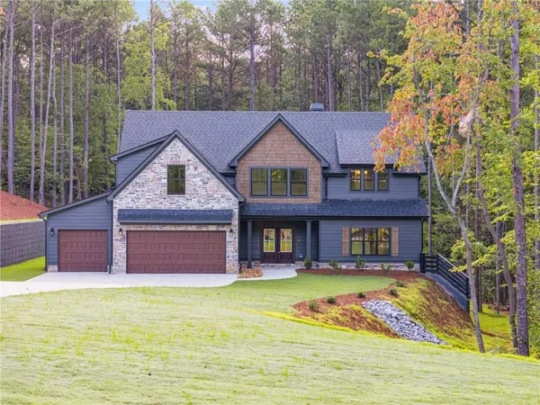 a front view of a house with garden