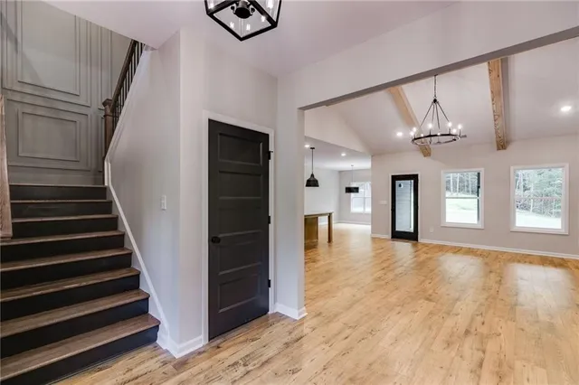 a kitchen with stainless steel appliances granite countertop a stove and a refrigerator