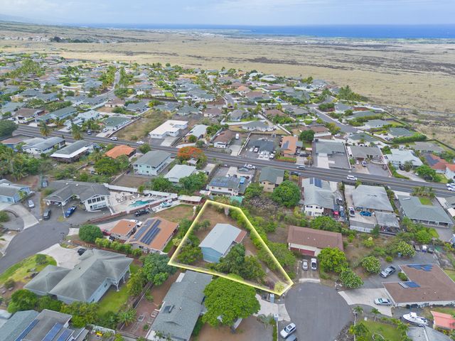 an aerial view of residential building and lake