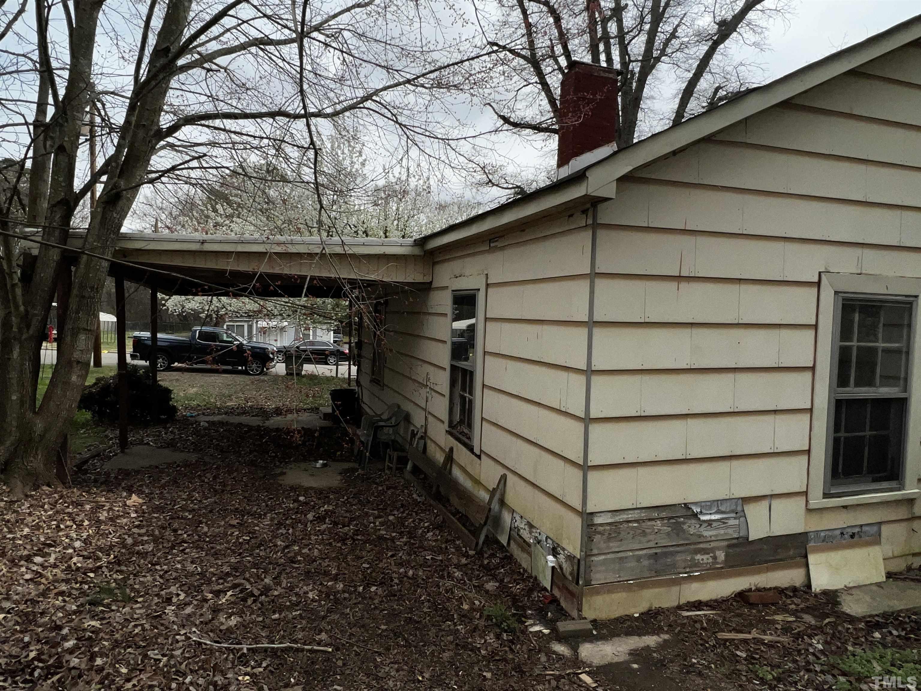 1259 Pointer Street Roxboro, NC 27573 - Photo 35 of 47 a side view of a house with a yard