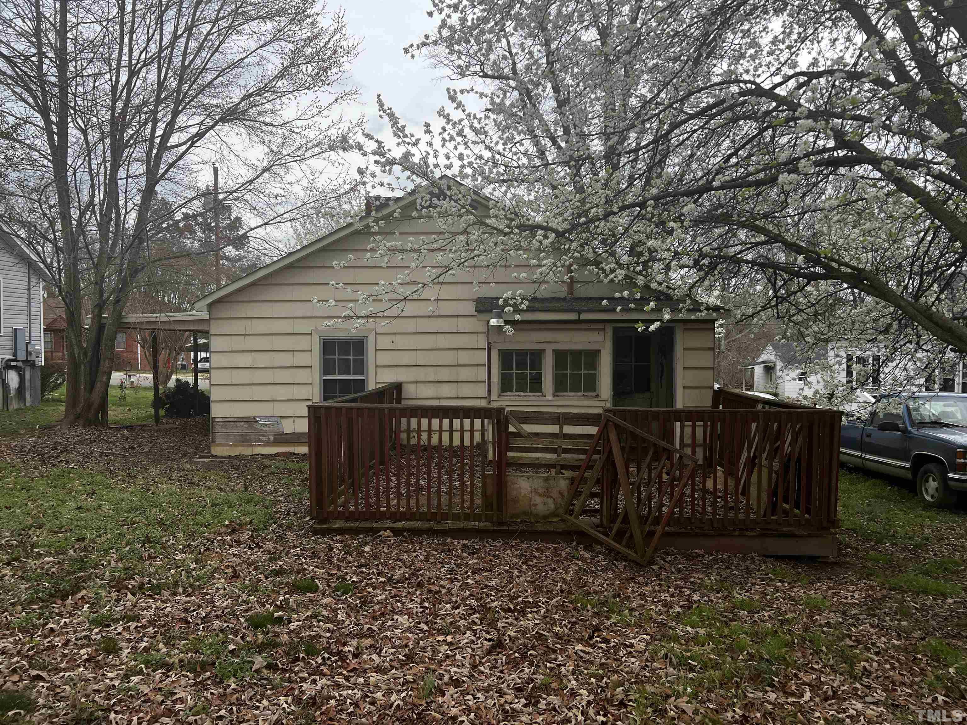 1259 Pointer Street Roxboro, NC 27573 - Photo 46 of 47 a view of a house with a yard and a large tree