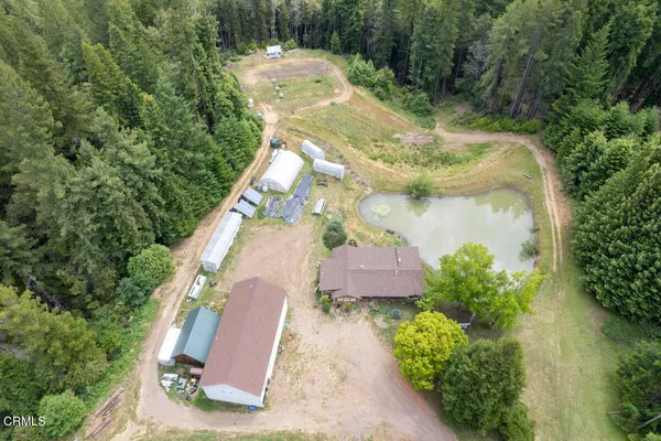 an aerial view of a house with outdoor space