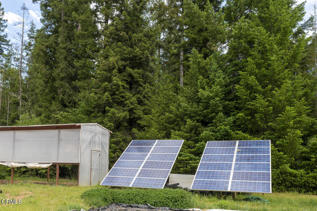 14480 Docker Hill Road Comptche, CA 95427 - Photo 19 of 27 a backyard of a house with yard and outdoor seating