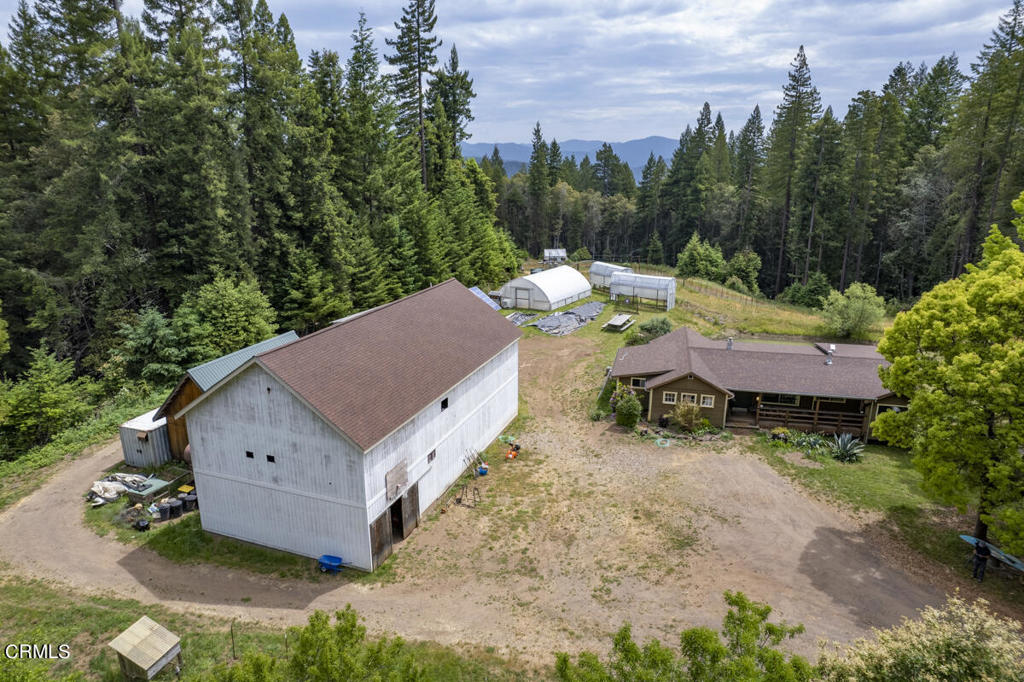 14480 Docker Hill Road Comptche, CA 95427 - Photo 22 of 27 an aerial view of a house with yard and lake view