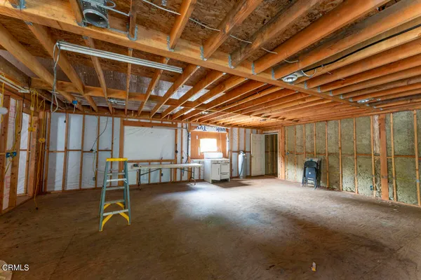 a view of a room with wooden walls