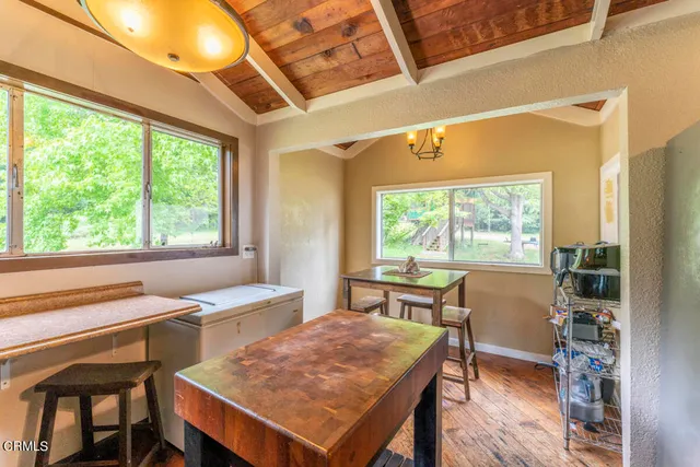a view of a dining room with furniture window and outside view