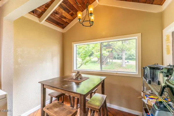 a view of a dining room with furniture window and outside view