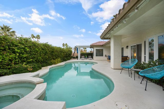 a view of a house with pool porch and furniture