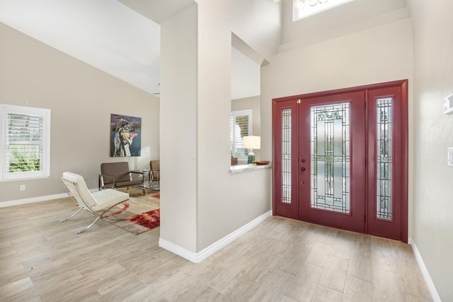 a view of a livingroom with furniture and windows