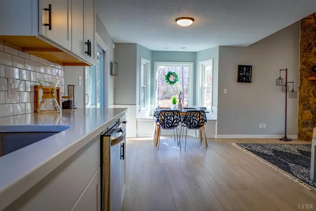 a white toilet sitting next to a window