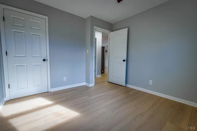 a view of an entryway with wooden floor