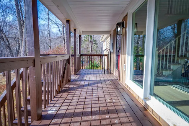 a view of a backyard with large trees