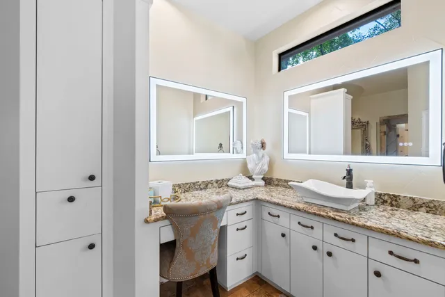 a bath tub sitting in a bathroom next to a window