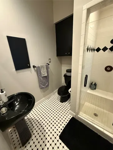 a living room with furniture a flat screen tv and a large window