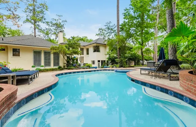 a view of a backyard with sitting area