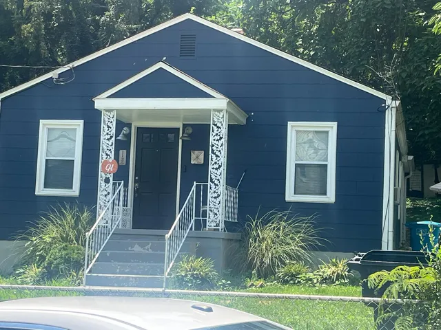 a front view of a house with garden